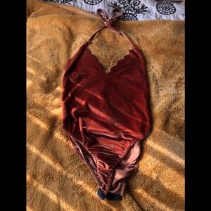 Cute burnt orange body suit from nasty gal